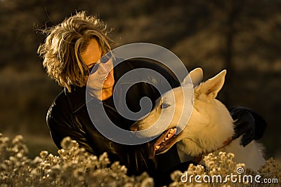 Happy smiling mature woman with dog Stock Photo