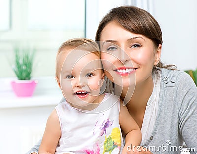 Happy Smiling Mother and Baby Stock Photo