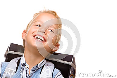 Happy smiling pupil (boy) with satchel Stock Photo