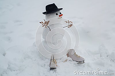 Happy smiling snow man on sunny winter day. Snowmen. Snowman. Happy funny snowman in the snow. Greeting snowman. Stock Photo