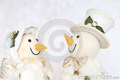 Happy smiling snowman couple. Snowwoman. Christmas Decoration Stock Photo