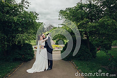 Look from above at beautiful wedding couple kissing in the eveni Stock Photo