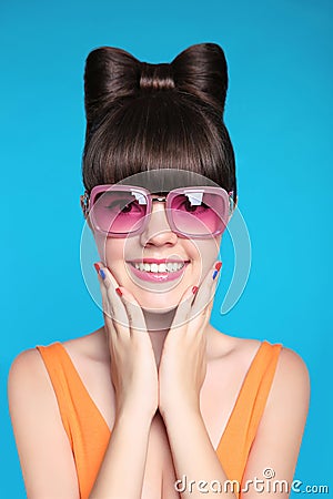 Happy smiling teen girl with bow hairstyle, funny model wearing Stock Photo