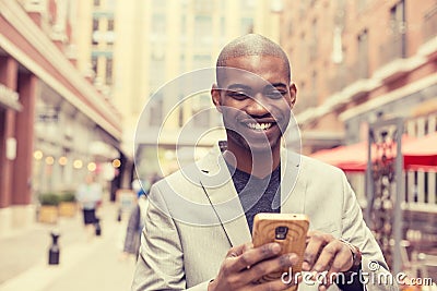 Happy smiling urban professional man using smart phone Stock Photo