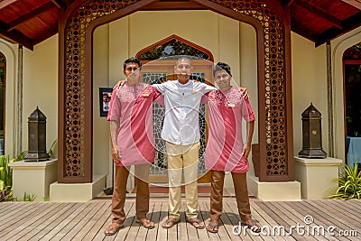 Happy smiling waiters team standing in uniform in front of arabic restaurant Editorial Stock Photo