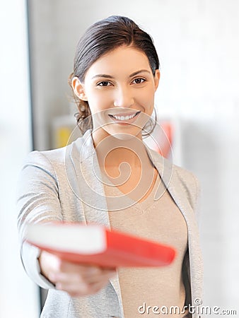 Happy and smiling woman with book Stock Photo