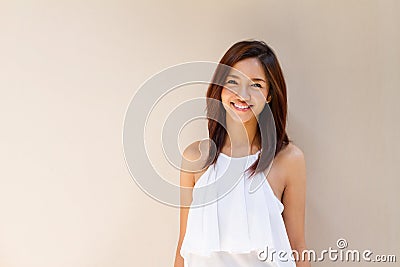 Happy smiling woman in casual dress, warm tone color Stock Photo