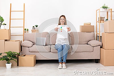 Happy smiling woman evaluating repair company, copy space Stock Photo
