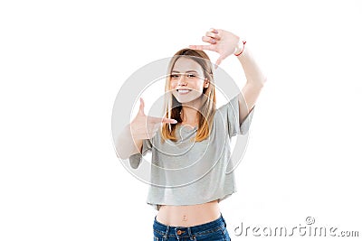 Happy smiling woman framing her face with her hands Stock Photo