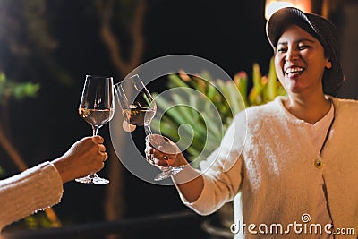 Happy smiling woman hand clicking glasses of wine celebration concept. Stock Photo