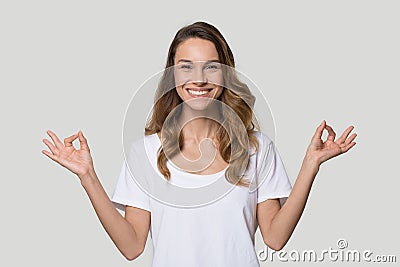 Happy smiling woman practicing yoga, meditating, breathing, stress relief Stock Photo