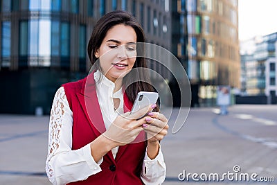 Happy smiling woman professional government worker reading good news in messenger on mobile phone Stock Photo