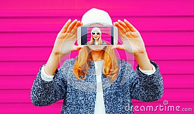 Happy smiling woman taking selfie close-up by smartphone having Stock Photo