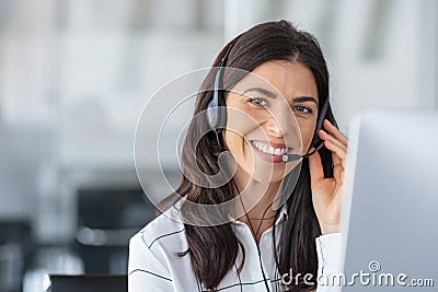 Happy smiling woman working in call center Stock Photo