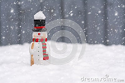 Happy snowman standing in christmas landscape with copy-space an Stock Photo