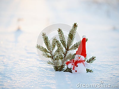 Happy snowman standing in winter christmas landscape.Snow background Stock Photo