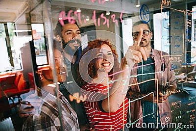 Happy software developers working on meeting, Programming advanced code artificial intelligence. Stock Photo