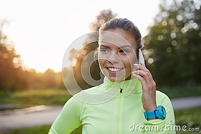 Happy sporstwoman talking on mobile Stock Photo