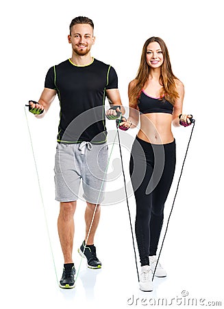 Happy sport couple - man and woman with with ropes on the white Stock Photo