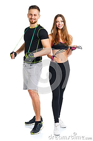 Happy sport couple - man and woman with with ropes on the white Stock Photo