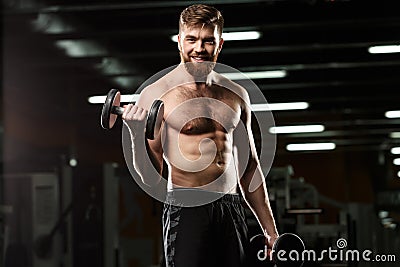 Happy sports man make sport exercises with dumbbells Stock Photo