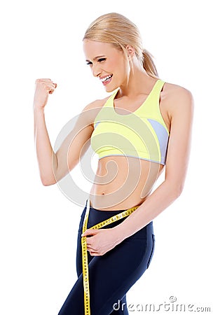 Happy sporty woman showing her muscle Stock Photo