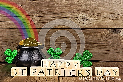 Happy St Patricks Day blocks with decor against wood Stock Photo