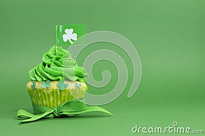 Happy St Patricks Day green cupcake with shamrock flag Stock Photo