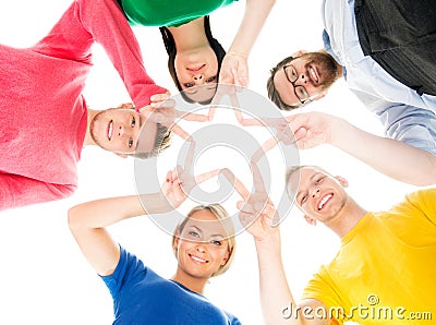 Happy students in colorful clothing standing together making a star with their fingers Stock Photo