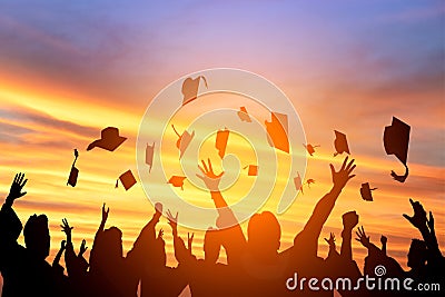 students throwing graduation caps in the Air Stock Photo