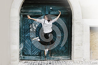 Happy stylish hipster woman jumping and having fun Stock Photo