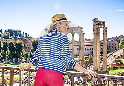 Happy stylish woman near Roman Forum in Rome, Italy sightseeing Stock Photo