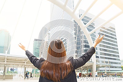 Happy successful asian businesswoman raised arms - business concept. Stock Photo