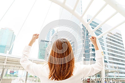 Happy successful asian businesswoman raised arms - business conc Stock Photo