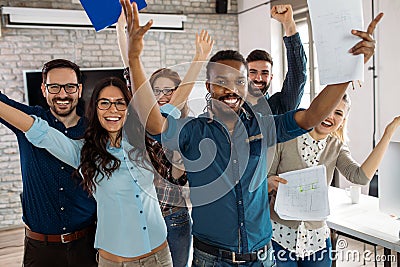 Happy successful company staff in office Stock Photo