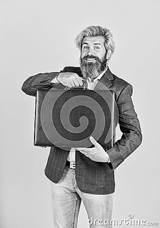 happy and successful man hold money case. bearded man show office briefcase. good business deal. successful business Stock Photo