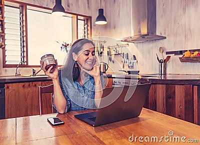 Happy successful young woman on laptop working from home in Coronavirus and New normal concept Stock Photo