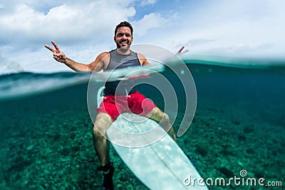 Happy surfer waits the wave on line up Stock Photo