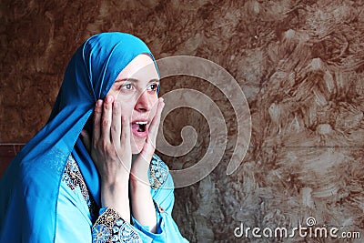 Happy surprised arab muslim woman Stock Photo