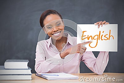 Happy teacher holding page showing english Stock Photo