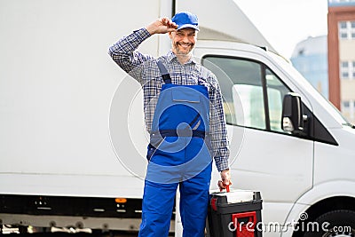 Happy Technician Service In Overall Near Van Stock Photo