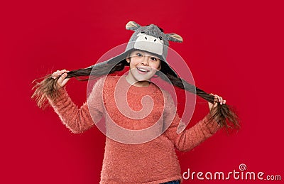 happy teen child wear sweater and earflap hat in studio. winter fashion for teen child. Stock Photo