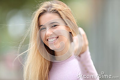 Happy teen gesturing come here in the street Stock Photo