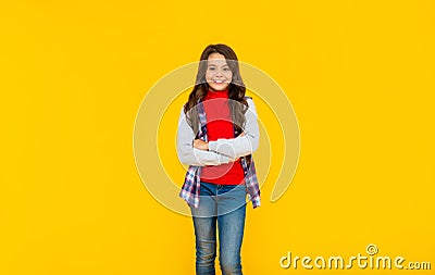 happy teen girl in casual clothes on yellow background, teeny Stock Photo