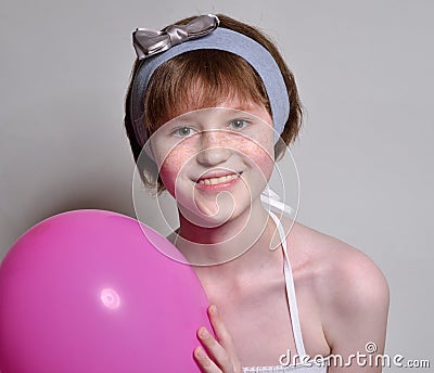 A happy teen with a rosy balloon Stock Photo