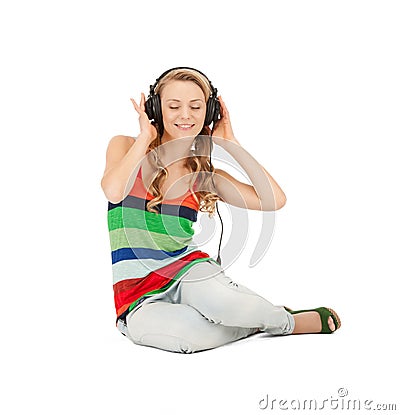 Happy teenage girl in big headphones Stock Photo