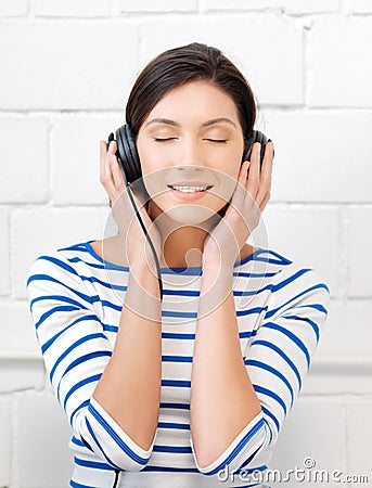 Happy teenage girl in big headphones Stock Photo