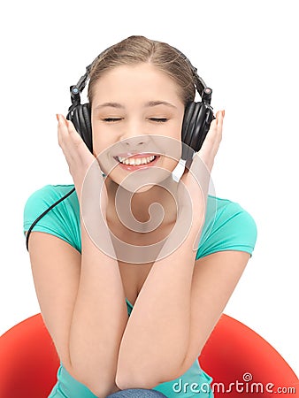 Happy teenage girl in big headphones Stock Photo