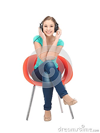 Happy teenage girl in big headphones Stock Photo