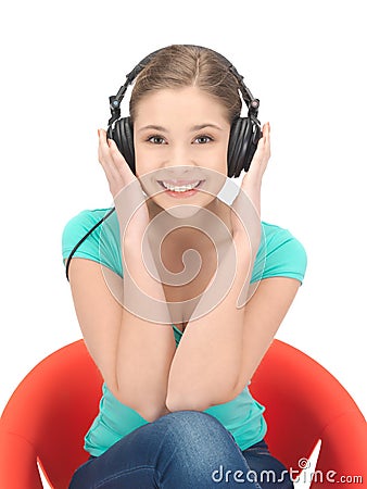 Happy teenage girl in big headphones Stock Photo